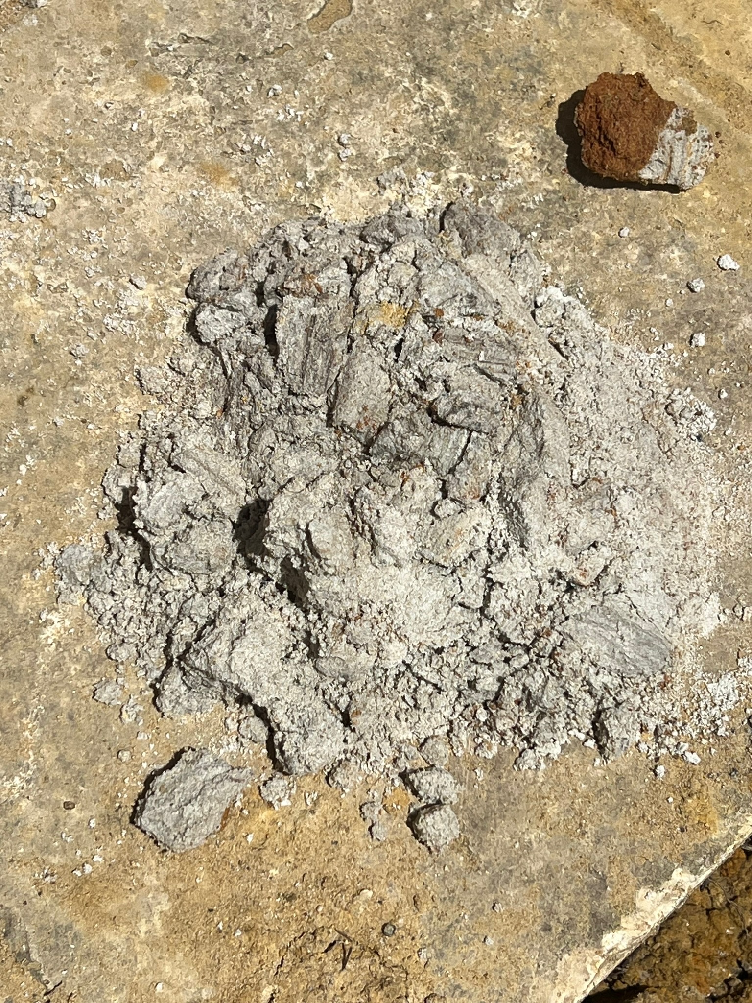 Red iron oxide pigment on stone